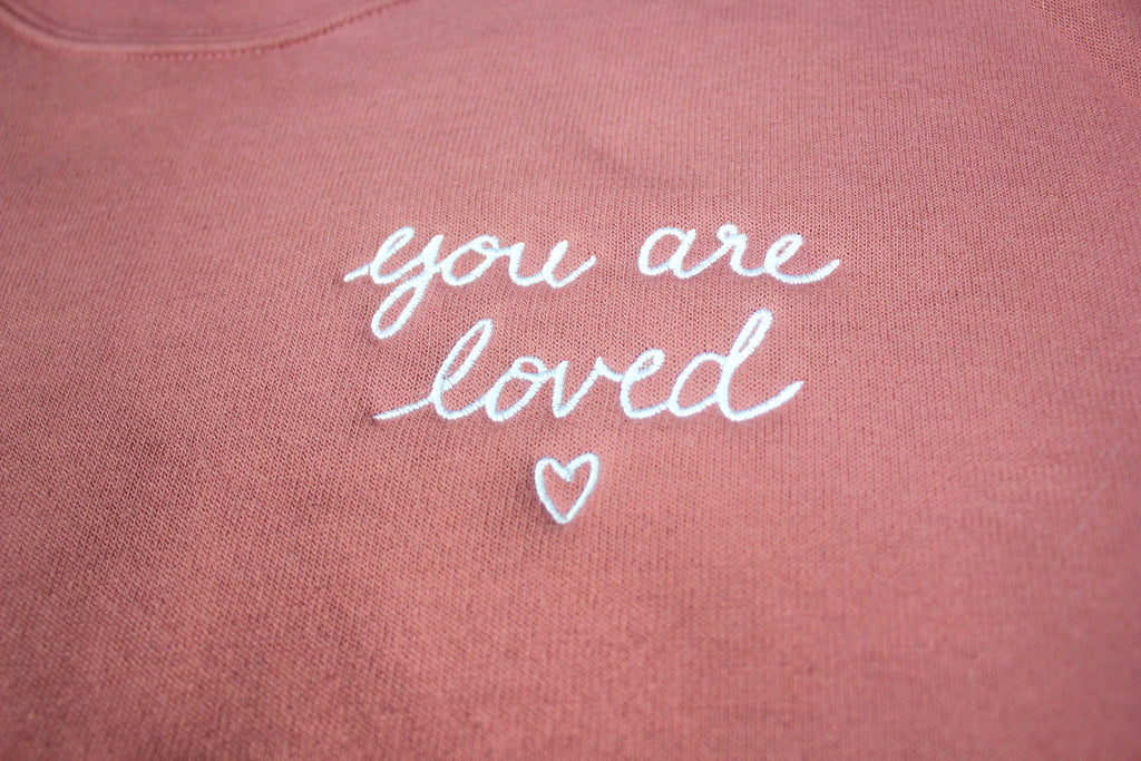 YOU ARE LOVED EMBROIDERED SCRIPT MAUVE WOMEN'S CROPPED CREW FLEECE
