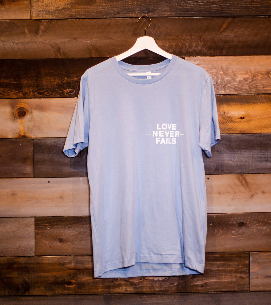 LOVE NEVER FAILS LIGHT BLUE SLEEVE T-SHIRT