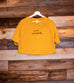 LOVE EVERYBODY MUSTARD WOMEN'S FLOWY CROPPED TEE
