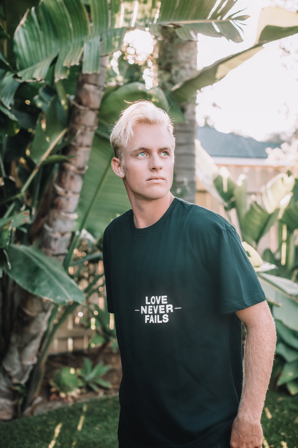 LOVE NEVER FAILS BLACK SLEEVE T-SHIRT