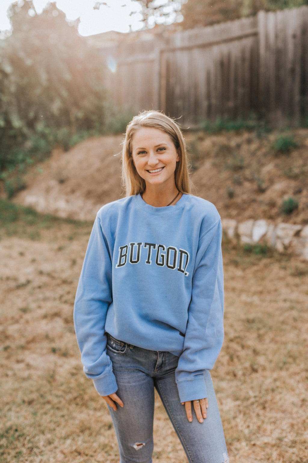 BUT GOD LIGHT BLUE CREWNECK SWEATSHIRT