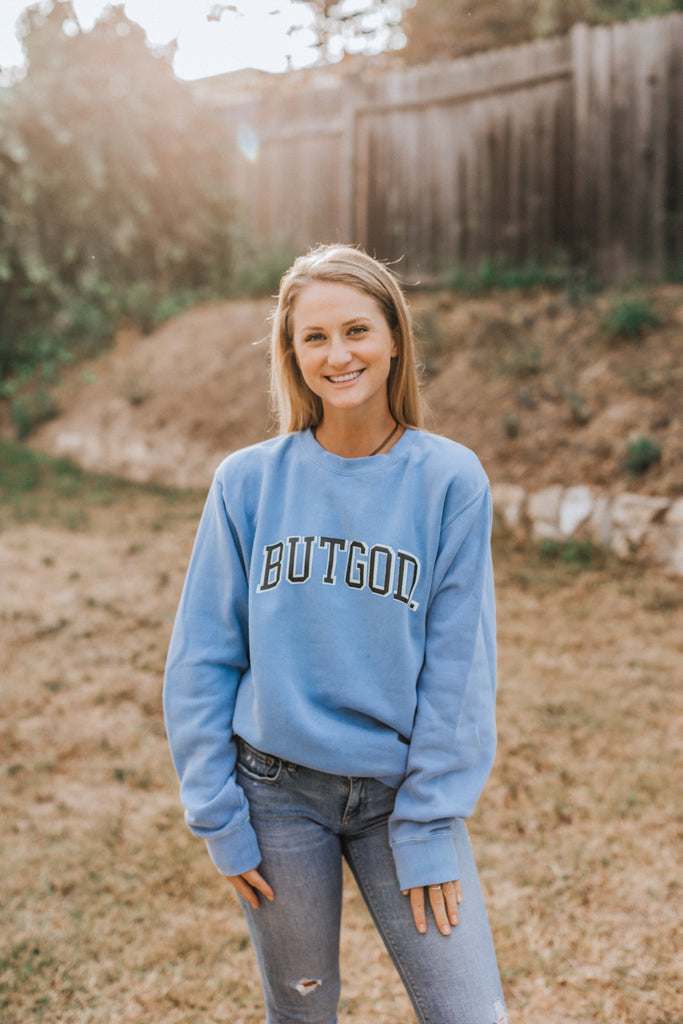 BUT GOD LIGHT BLUE CREWNECK SWEATSHIRT