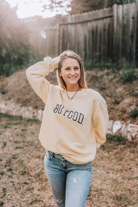 BUT GOD YELLOW CREWNECK SWEATSHIRT