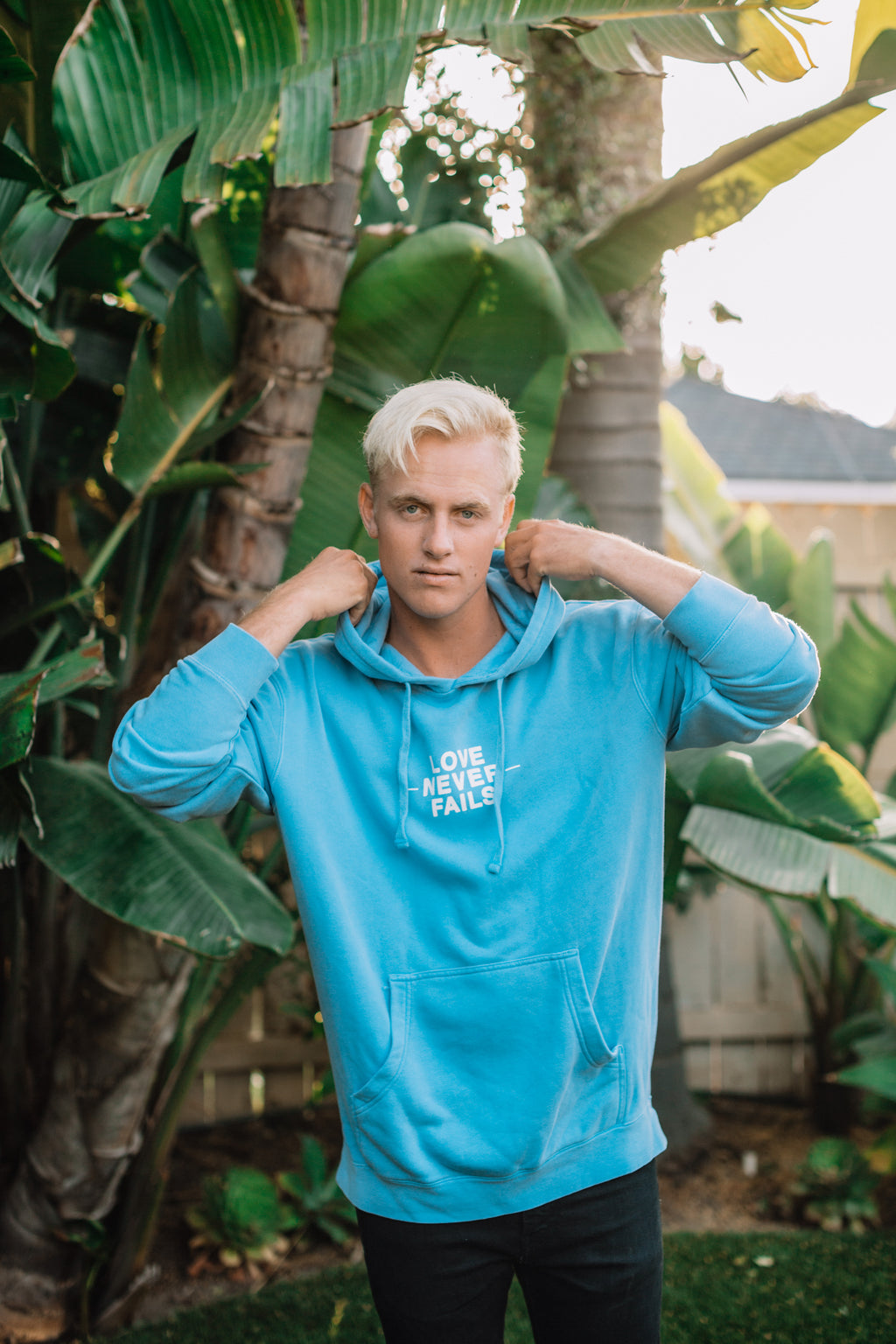 LOVE NEVER FAILS LIGHT BLUE HOODIE
