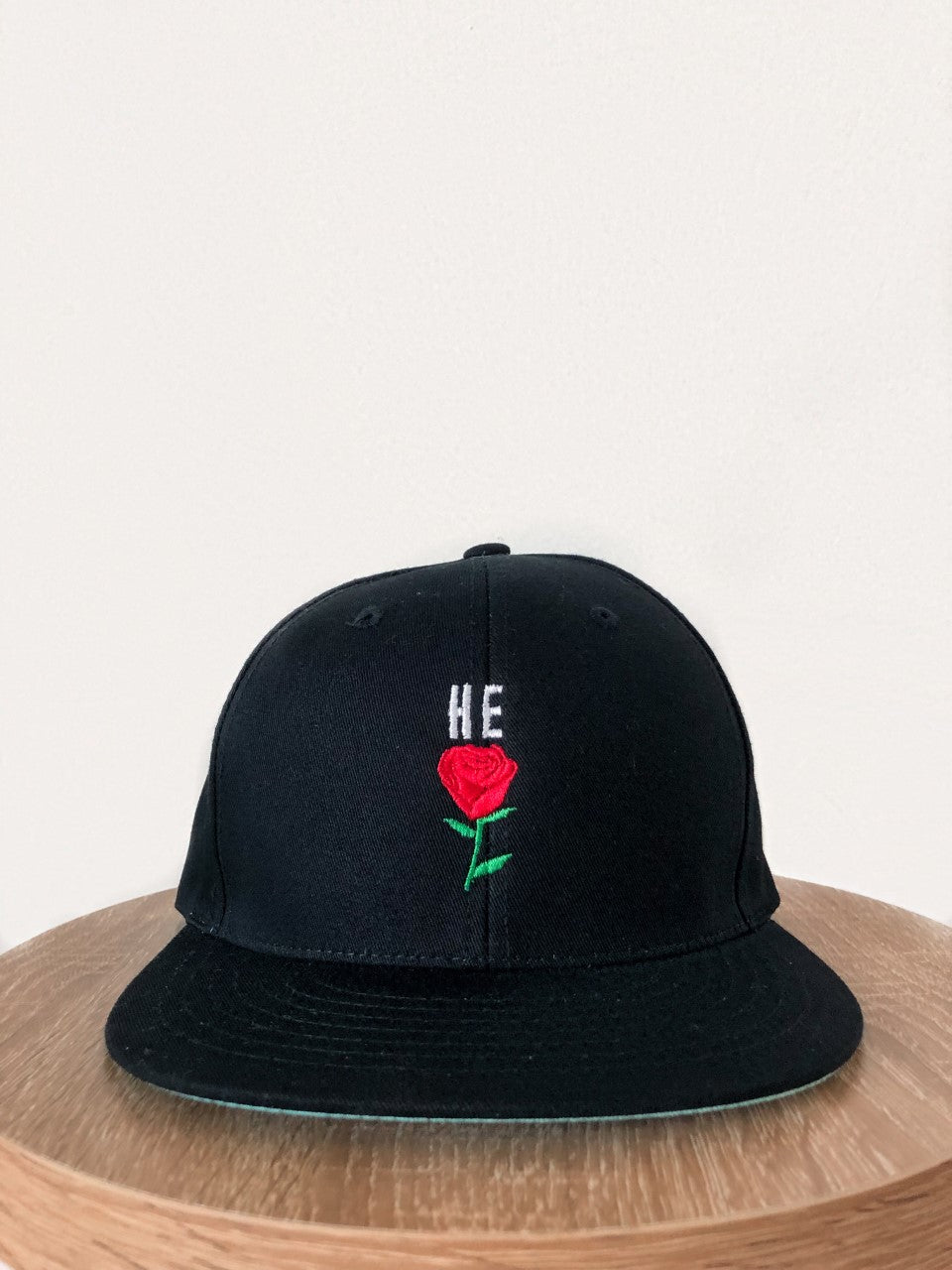 HE ROSE BLACK SNAPBACK CAP